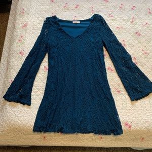 Blue lace dress with bell sleeves.